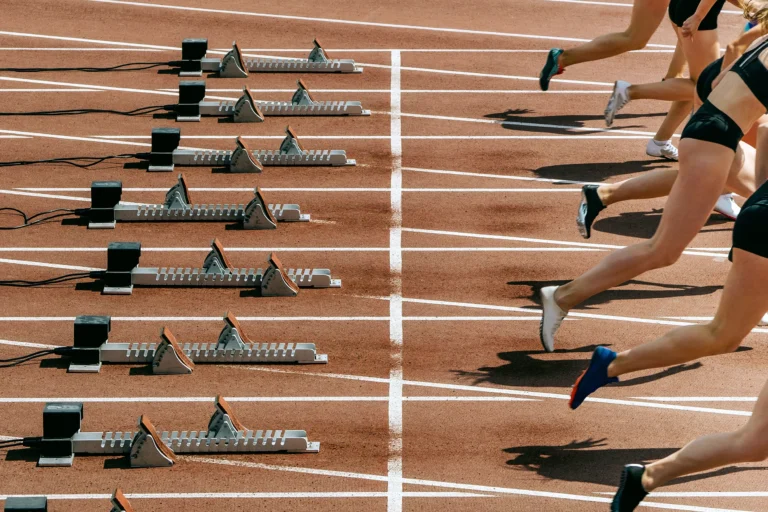 athletes-starting-sprint-on-running-track-2026-01-07-23-52-41-utc